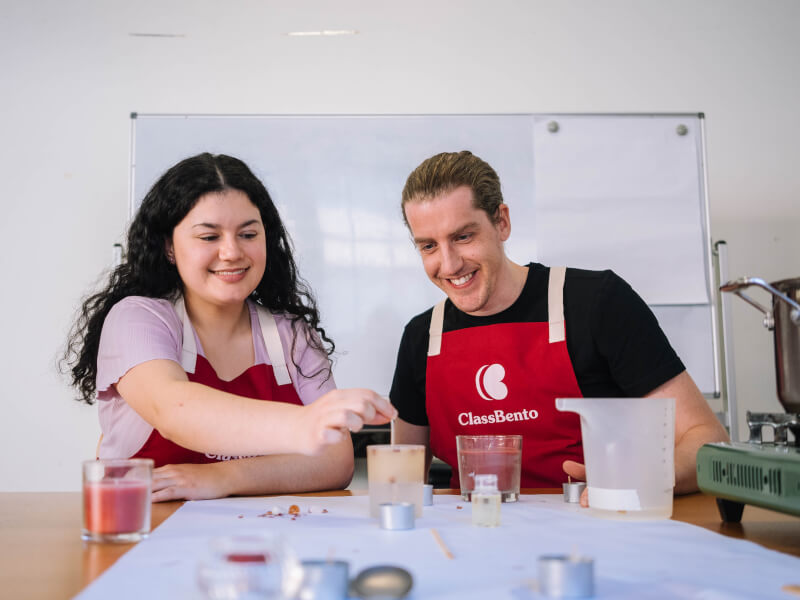 Couple smiling at a candle making class